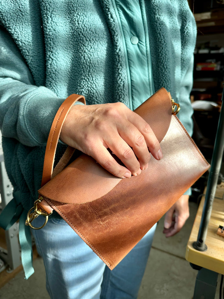Hip bag in hand with wristlet