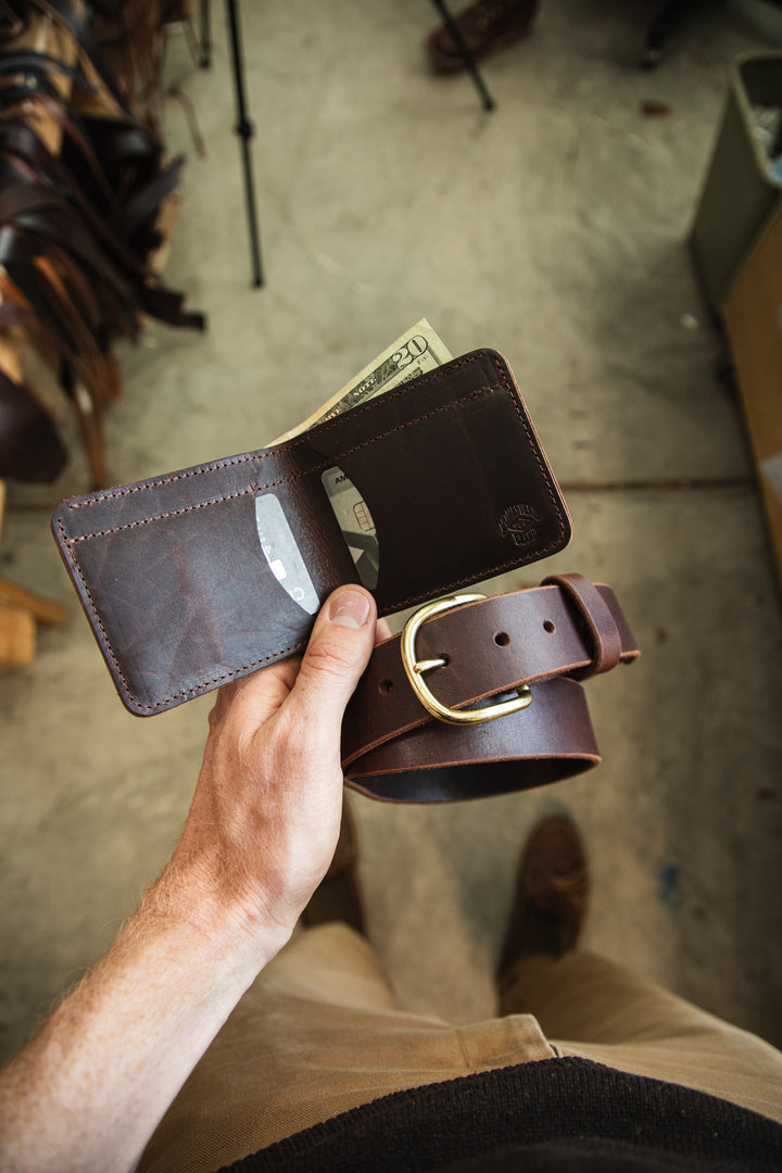 Belt and wallet bundle creative belt and bifold overhead in hand