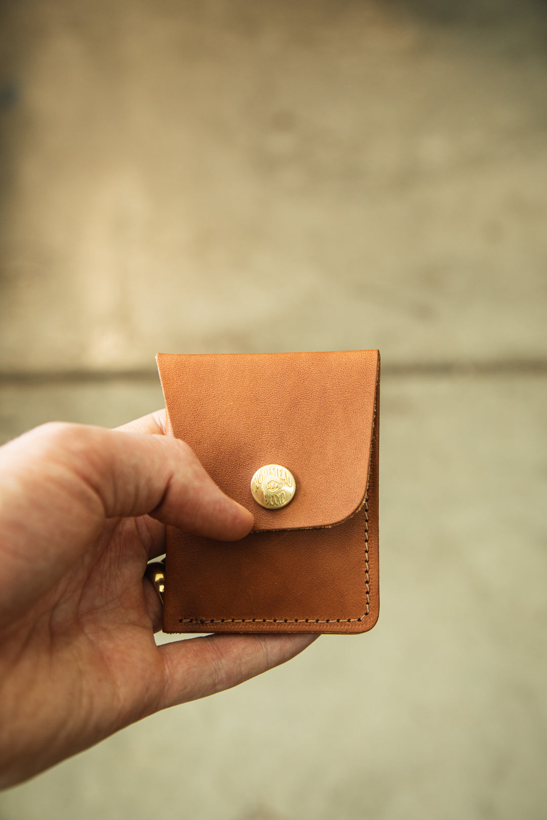 Minimalist wallet creative front snap flap closed #color_bourbon