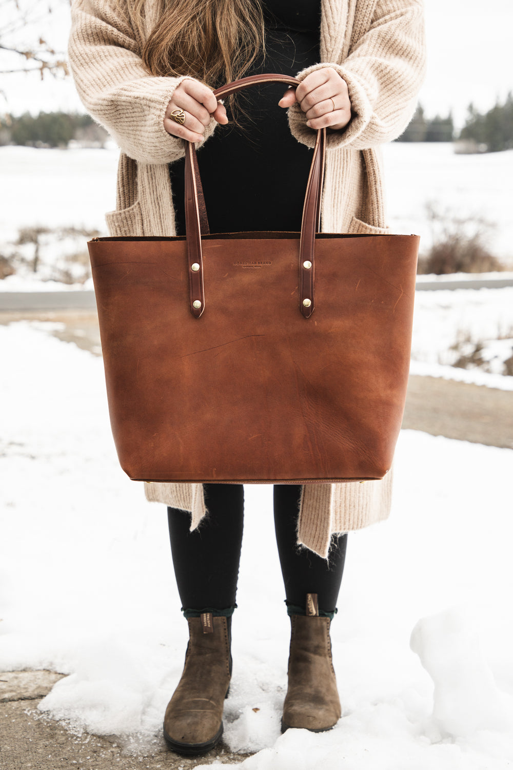 Classic Tote Brown Creative Holding Bag Front Shot Chest Down #color_brown