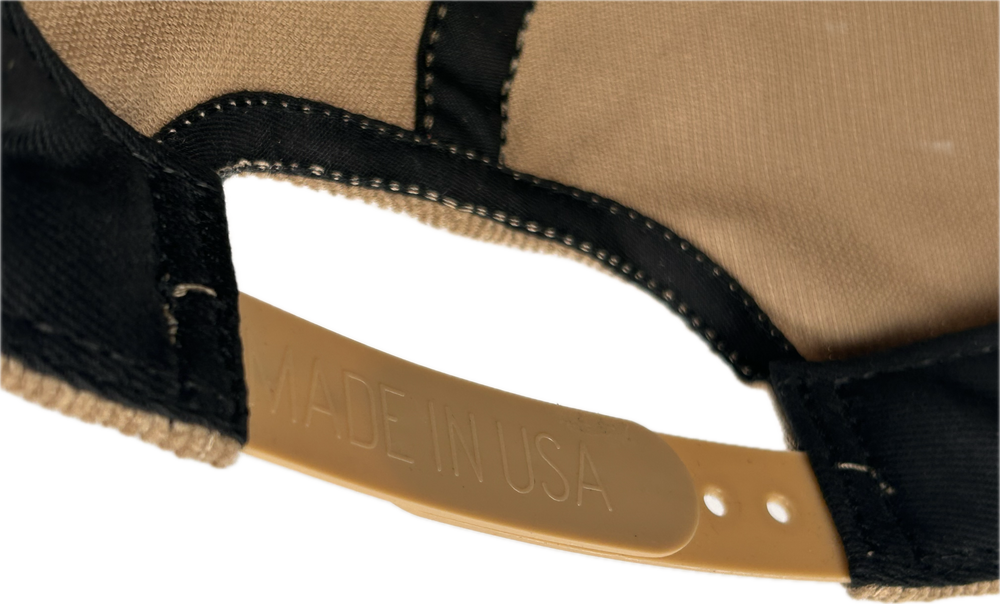 Inside of the SnapBack adjuster on hat, the backside of the adjuster reads “made in USA” 