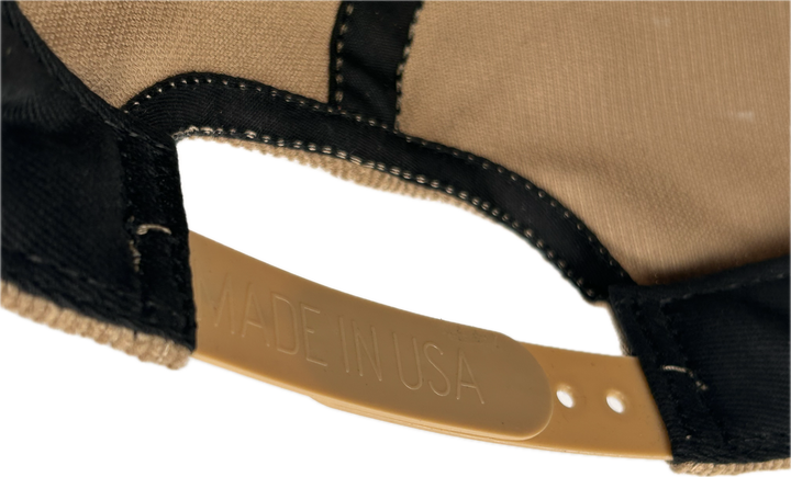 Inside of the SnapBack adjuster on hat, the backside of the adjuster reads “made in USA” 