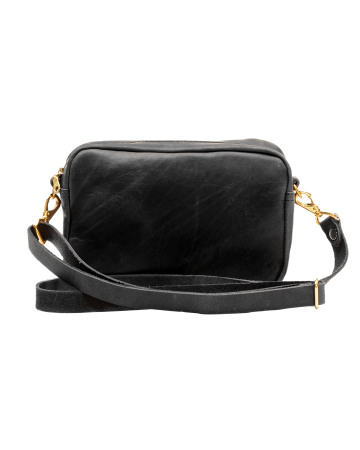 Black leather crossbody bag with gold accents on a white background #color_black