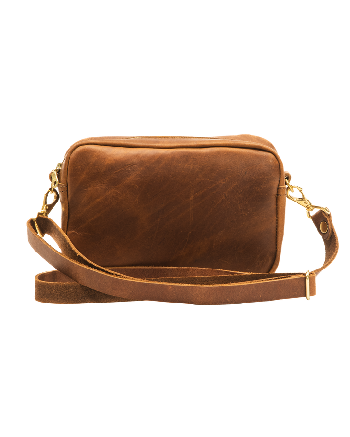 Brown leather crossbody bag on a white background #color_brown