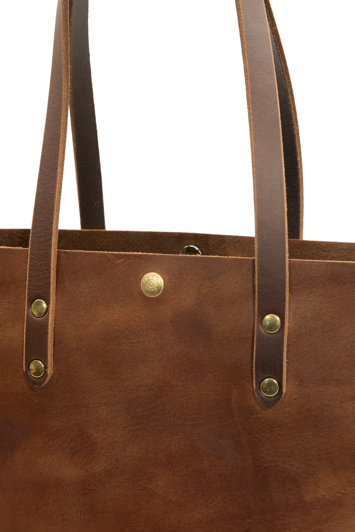 classic tote in brown front detail shot #color_brown