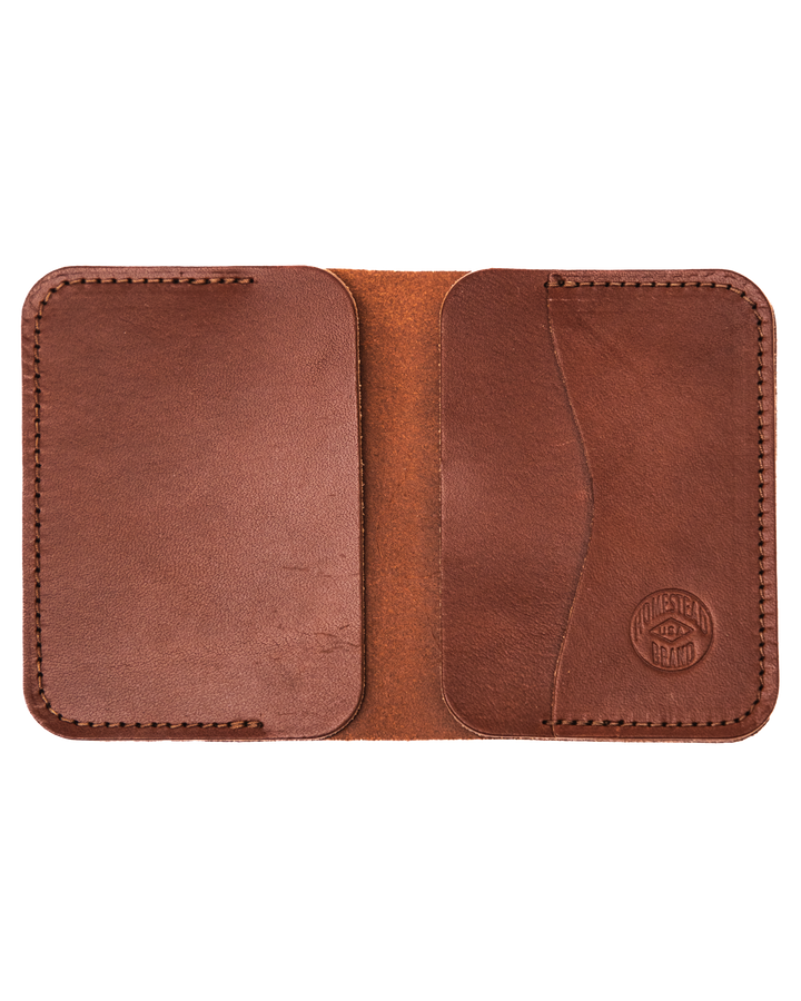 Brown leather wallet with visible stitching on a white background #color_brown