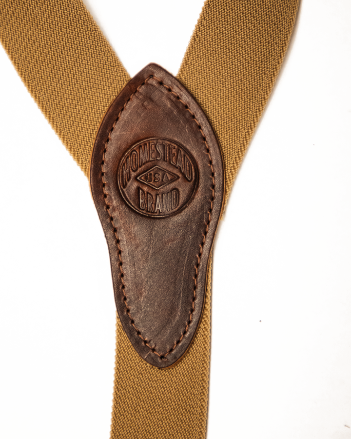 Brown suspenders with leather strap featuring &