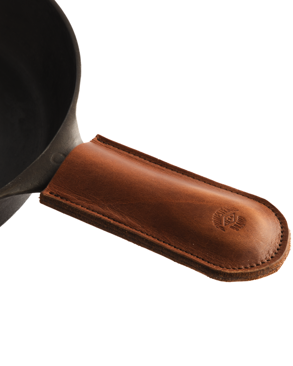 brown leather skillet sleeve on skillet zoomed angled