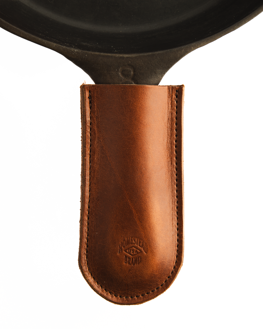 brown leather skillet sleeve on skillet zoomed